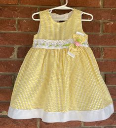 "Toddler Dress, vintage sundress, size 24M 24 mo, Rare Editions, 80s 90s, fancy, yellow gingham, bow flower lace, Easter dress, wedding, vaca Rare Editions size 24 months 55% Cotton 45% Polyester Shoulder to hem: 20\" pit to pit 12\" beautiful details - ribbons, bows an lace! Interested in more vintage fashion or handmade items? etsy.com/shop/canzaliaprons" Spring Picnic Dress With Bow, Cute Yellow Dress For Picnic, Spring Gingham Dresses Lined, Spring Gingham Lined Dress, Yellow Spring Dress With Bow, Cute Gingham Dresses With Lace Trim, Cute Yellow Dresses With Lace Trim, Cute Yellow Dress With Lace Trim, Yellow Sundress For Spring Dress-up