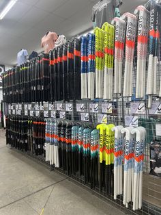 many different types of skis on display in a store