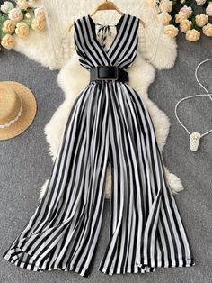 Black and White Striped Wide Leg Jumpsuit Elegant V-neck Jumpsuit For Beach, Elegant V-neck Jumpsuits And Rompers For Beach, Elegant Vacation Jumpsuits And Rompers With V-neck, Elegant V-neck Jumpsuits And Rompers For Summer, Elegant V-neck Jumpsuits And Rompers For Vacation, Elegant V-neck Jumpsuit For Vacation, Chic Wide Leg Beach Jumpsuits And Rompers, Chic Wide-leg Beach Jumpsuits And Rompers, White Maxi Jumpsuits And Rompers For Spring