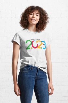 Fun and fresh, this class of 2023 design is a great way to start the school year. Simple lettering contrasts with shades of green, red, yellow and blue for a design that really pops. Vintage Cowgirl, Couple Beach, Cow Boy, Mama Bear, Comfy Tees, Fashion Essentials, Purple Flowers, Tshirt Colors, Unisex Hoodies