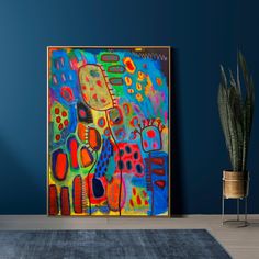 an abstract painting on a blue wall next to a potted plant in a living room