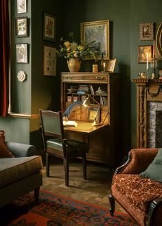 a living room filled with furniture and a fire place next to a painting on the wall