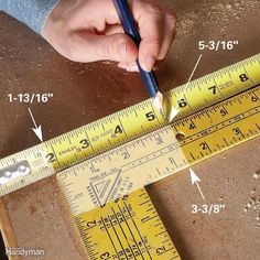 a person is measuring the height of a piece of wood with a ruler on it