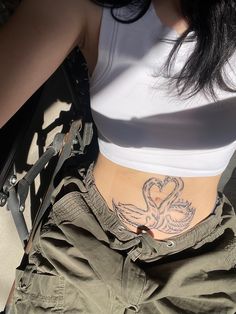 a woman with a tattoo on her stomach