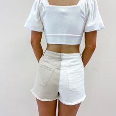 - 100% Cotton - Tan + white color - Model is pictured in a size small - Waist measurements: S - 26", M - 28", L - 30" Fitted High-waist Cotton Jean Shorts, Fitted High Waist Cotton Jean Shorts, Trendy White Denim Shorts, Chic White Fitted Jean Shorts, White Denim Jean Shorts For Summer, Beige Denim Bottoms For Summer, Fitted Cotton Jean Shorts For Day Out, Summer Beige Denim Bottoms, Trendy High-waist White Jean Shorts