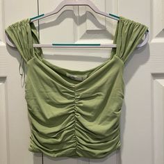 New With Tags Color Green Size M Will Ship Within 2 Business Days Price Is Negotiable So Feel Free To Make Me An Offer:) This Top Is So Fun And Perfect For Warm Weather! I Added Model Photos Of The Top In Another Color Casual Cotton Ruched Tank Top, Spring Ruched Cotton Crop Top, Casual Green Crop Top For Spring, Casual Ruched Crop Top For Spring, Trendy Ruched Tops For Spring, Ruched Trendy Tank Top For Spring, Trendy Ruched Tank Top For Spring, Casual Ruched Crop Top For Summer, Casual Ruched Crop Top For Day Out