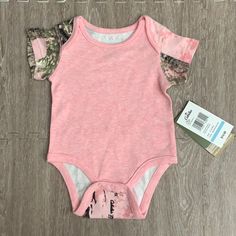 Pink Camouflage Bodysuit. Size 6-12 Months New With Tags Pink Fitted Onesie For Playtime, Pink Casual Bodysuit For Playwear, Pink Short Sleeve Onesie For Playwear, Pink Fitted Bodysuit For Playtime, Pink Bodysuit For Playtime, Pink Camouflage, 12 Months, Pink And Green, Camouflage