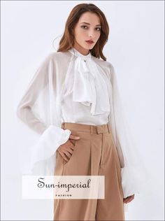 Gender: WomenMaterial: COTTONMaterial: PolyesterClothing Length: REGULARStyle:VintageFabric Type: ChiffonSleeve Length(cm): FullDecoration: BowPattern Type: SolidCollar: StandSleeve Style: lantern Sleeve SIZE S:Bust:82cm,Raglan Sleeve Length:95cm,Length:54cm M:Bust:84cm,Raglan Sleeve Length:96cm,Length:55cm L:Bust:86cm,Raglan Sleeve Length:97cm,Length:56cm Note: 1 inch = 2.54 cm, 1 cm = 0.39 inch note: measurement by hands allow 2-3cm errors which is normal Sizing advice : Most items run small ( Imperial Fashion, Bow Tie Blouse, Lantern Sleeved Blouses, Tie Blouse, Sheer Chiffon, Lantern Sleeve, Sheer Blouse, Lantern Sleeves, Elegant Style