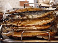 some fish are sitting on top of each other in a metal pan and ready to be cooked