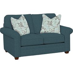 a blue couch with two pillows on the arm and one pillow in front of it