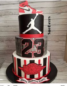 a three tiered cake with the number 25 on it