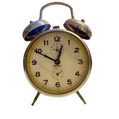 an old fashioned alarm clock on a white background