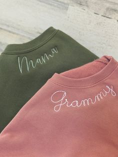 two sweatshirts with the word namma written on them, one in green and one in pink