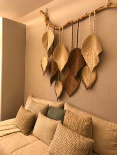 a living room filled with lots of furniture and decor on top of a wooden wall