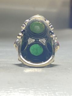 "Emerald Ring Ruby long sterling silver women Low grade stones Size 6.50 Weight 14.8g Length 1 1/2\" Width. 1/2\" Thinnest part of band. 1/8\" Free Shipping & Free Postal Insurance Delivered in a Gift Box If you do not want the ring polished and want to leave the natural patina please let me know at the time of purchase as I do polish rings before I ship rings out. Thanks Free First Class shipping and postal insurance is included. If you want to upgrade to priority kindly pay an additional f Antique Multi-stone Round Jewelry, Heirloom Jewelry For Collectors With Stone Setting, Unique Hallmarked Emerald Ring In Sterling Silver, Emerald Multi-stone Jewelry, Oval Multi-stone Spiritual Rings, Antique Green Multi-stone Ring, Spiritual Oval Multi-stone Rings, Spiritual Multi-stone Oval Rings, Unique Multi-stone Emerald Jewelry