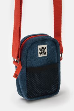 a small blue bag with an orange strap