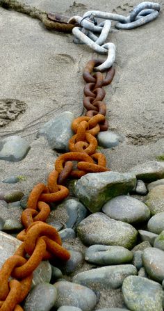 an orange chain sitting on top of some rocks