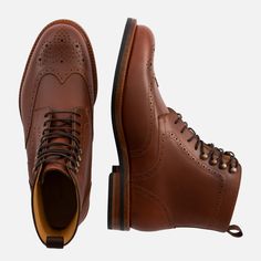 Brown Bridle Leather Wingtip Boots, Rugged Brown Wingtip Boots, Classic Brown Chelsea Boots With Vibram Sole, Masculine Boots With Brogue Detailing And Plain Toe, Masculine Brogue Boots With Plain Toe, Masculine Wingtip Boots With Leather Sole, Masculine Plain Toe Boots With Brogue Detailing, Business Wingtip Boots With Vibram Sole, Timeless Boots