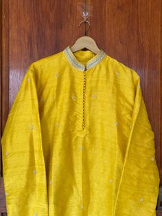 pure silk paithani mens kurta/mens kurta set/cream mens kurta /haldi mens kurta/Indian mens wear/chikankari kurta/groom wedding indian kurta/hand embroidered wedding kurta/yellow  kurta     Well..!! we understand that you may not get in your desired size/pattern, here you go with customization according to your size/pattern which we can deliver in 1-2 weeks of time period !!      Here is a beautiful pure silk yellow hand embroidered mens kurta with simple buti highlights as shown !!this Kurtas c Yellow Chanderi Sherwani Straight Kurta, Yellow Silk Kurta For Eid, Yellow Chanderi Sherwani With Resham Embroidery, Yellow Sherwani With Resham Embroidery In Chanderi, Long Sleeve Slub Silk Sherwani For Festivals, Yellow Silk Long Sleeve Kurta, Festival Long Sleeve Slub Silk Sherwani, Yellow Raw Silk Salwar Kameez With Chikankari Embroidery, Yellow Chikankari Embroidery Raw Silk Salwar Kameez