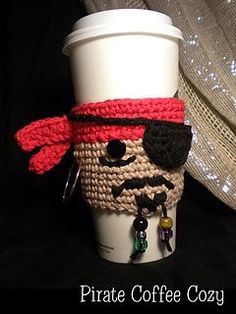 a crocheted coffee cup holder with a pirate face on it