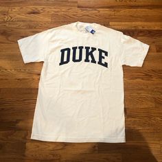 -White & Blue -Size Medium -Brand New W Tags! -From Duke University Bookstore On Campus! -Purchased When I Visited Duke, But Never Wore Short Sleeve University Logo Graphic Tee, White University Logo T-shirt With Crew Neck, White University Logo T-shirt, Duke Shirt, Duke University Basketball, Duke University, Anthropologie Top, Yellow Shorts, Suit Shop