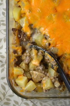 a casserole dish with meat, potatoes and gravy