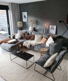 a living room filled with lots of furniture and decor