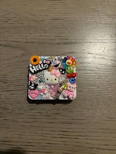 the hello kitty phone case has many different items on it