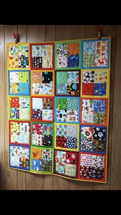 a colorful quilt hanging on the wall