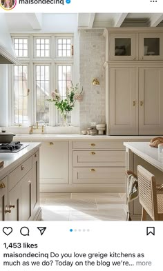 an instagramted photo of a kitchen with white cabinets