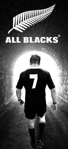 a rugby player walking into a tunnel with the number seven on it's back