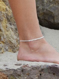 This Sterling Silver Coin Anklet is an elegant addition to any outfit. The solid sterling silver discs make for a striking look that will get noticed. Whether you pair it with sandals at the beach or dress it up with your favorite shoes, it is sure to turn heads. ● 925 Sterling Silver Elegant Silver Barefoot Sandals For Summer, Silver Barefoot Sandals For Summer Gift, Elegant Silver Anklets For The Beach, Silver Elegant Barefoot Sandals For Festivals, Elegant Silver Barefoot Sandals For Festivals, Beach Toe Ring Jewelry, Silver Dainty Bracelets For Beach, Elegant Sterling Silver Bracelets For Summer, Elegant Sterling Silver Anklets For Summer