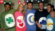 group of people in costumes posing for the camera