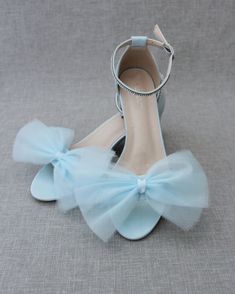 Classy satin block heel with rows of rhinestones on ankle strap and added soft tulle bow. Sparkly and glamour is great combination and will definitely be a favorite.** YOU CAN CHOOSE ANKLE STRAP OPTIONS AT CHECK OUT **DETAILS:FIT: RUNS LARGE, ORDER ONE SIZE DOWNHEEL HEIGHT: 2 inchesCOLORS AVAILABLE: White, Ivory, Light Blue, Dusty Pink, and NavyUPPER: Synthetic upper and liningMATERIALS: Mandmade outsole STYLE NAME: NAOMI Prom Sandals With Bow And Block Heel, Block Heel Sandals With Bow For Prom, Formal Tulle High Heels, Spring Prom Sandals With Satin Bow, Spring Formal Tulle Heels, Formal Tulle Open Toe Heels, Summer Wedding Tulle Heels, Ankle Strap Tulle Heels For Parties, Open Toe Tulle Heels For Party