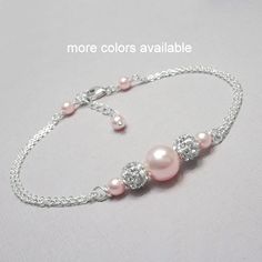 "Swarovski Light Pink Pearl Bridesmaid Bracelet, Bridesmaid Jewelry, Bridesmaid Gift Made with swarovski pearls, pave spacers and sterling silver chain Also available in other colors.  Please see color chart for options. BRACELET SIZE:  Please see sizing guide and select preference from drop down list Beautifully gift packaged, ready to gift. If you want the item gift packaged with a message, please type your message in the \"add your personalization\" box or in the \"add a note to alexandreasje Bridesmaid Pearl Bracelet, Swarovski Pearls Bracelet, Bridesmaid Pearls, Bracelet Pearl, Purple Bracelet, Beads Bracelet Design, Jewelry Bridesmaid, Bridesmaid Bracelet, Rhinestone Bridal