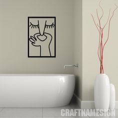 a white bath tub sitting next to a painting on the wall