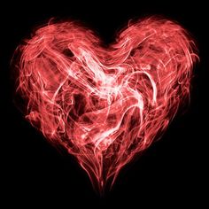 a red heart is shown in the dark