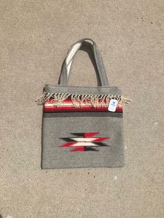 "Beautiful 70s deadstock 100% wool hand woven bag by Ortega's. Made in Chimayo, New Mexico. Native style pattern with fringes lined around top of bag. Velcro closure. Overall condition is excellent with no major flaws noted. Please see all photos for details. Refer to measurements below 13\" in height 13\" in length" Vintage Rectangular Fringe Bag, Traditional Fringe Bag For Everyday Use, Artisan Rectangular Shoulder Bag With Fringe, Artisan Fringe Rectangular Shoulder Bag, Artisan Rectangular Fringe Shoulder Bag, Chimayo Pattern, Chimayo New Mexico, Western Mules, Navajo Pattern