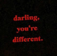 the words daring, you're different lit up in red on a black background