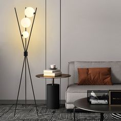 a living room scene with focus on the floor lamp and table next to the couch