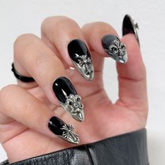 These Nail Gems Sets are great for getting a variety of nail decors in one package! This Vintage Silver Chrome Icons set includes 30 pieces of metallic crosses, Fleur-de-lis and stars, they are perfect for accessorizing Halloween nails, goth nails and the trendy chrome hearts nails. Shapes include: Crosses, Fleurs-de-lis and StarsSize: 5mm x 9mm ~ 10mm x 10mmPack of 30 pieces with 5 of each shape. Application: Apply a small amount of nail jewelry adhesive such as Stay Put Jewelry Gel or Brush-On Goth Nail Charms, Silver Chrome Hearts Nails, Gothic Chrome Nails, Goth Nails With Charms, Heartagram Nails, Cross Gem Nails, Black Chrome Heart Nails, Gel Nails With Charms, Goth Gel Nails