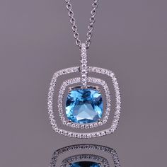 The cushion cut blue topaz appears to float in a double frame of sparkling Diamonds. The unique setting lends an element of motion to the pendant that is both eye catching and elegant. Handset in the pendant are 88 of the finest Diamonds you will ever find. Double Frame, Halo Pendant, Double Halo, Pop Of Color, Quality Diamonds, Cushion Cut, White Diamond, Blue Topaz, Float