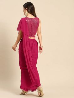 Step out in style with this set from VitansEthnics. Don this look this season for a festive outing with family and friends. Pair it with heels and a clutch to complete the look. Add chunky jewelry like jhumkas and choker accessories. The clothing set consists of one shoulder crop top with a skirt and an attached dupatta. Sizes: To Fit Bust(in inches): S(33), M(35), L(37), XL(39), 2XL(41) To Fit Waist(in inches): S(29), M(31), L(33), XL(35), 2XL(37) Fabric: Georgette Style: Crop Top With Skirt an Frill Gown, Crop Top With Skirt, Magenta Top, Top With Skirt, One Shoulder Crop Top, Saree Gown, Indo Western Dress, Ready To Wear Saree, Color Magenta