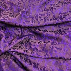 a purple and black paisley print fabric