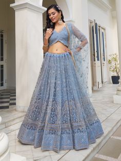 Step into the serene beauty of this enchanting light blue butterfly net lehenga, adorned with delicate cotton threadwork, sequins, and embroidered motifs. The soft and soothing hue of light blue evokes a sense of tranquility and elegance, while the meticulous craftsmanship adds a touch of refinement to the ensemble.
The semi-stitched lehenga boasts a generous 3-meter flair, allowing for graceful movement with every step, and can be tailored up to 42 inches for a customized fit. Paired with an un Luxury Light Blue Lehenga For Festivals, Luxury Light Blue Anarkali Choli, Luxury Light Blue Choli With Zari Work, Luxury Light Blue Lehenga With Resham Embroidery, Luxury Light Blue Choli With Dupatta, Luxury Light Blue Choli For Party, Luxury Light Blue Dupatta For Festivals, Luxury Light Blue Designer Lehenga, Luxury Light Blue Elegant Lehenga