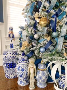 a decorated christmas tree with blue and white ornaments