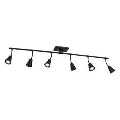 four light track fixture with black finish on an isolated white background, the lighting is dim