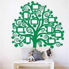 a family tree wall decal with frames and hearts on it's trunk, in a child's room