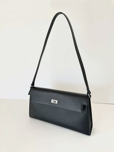 A classic day-and-night favorite from FREYA ESTEPHAN. Pochette shoulder bag  * 100% genuine leather   * 27.5cm wide x 6cm deep x 15cm high   * Silver hardware. Buckle closure  * 42cm height including shoulder strap  * Colour: black NEW, with tags Classic Satchel Baguette Bag For Business, Classic Satchel Baguette Bag For Formal Occasions, Elegant Textured Leather Baguette Bag For Everyday Use, Elegant Daily Use Baguette Bag With Smooth Grain, Classic Clutch Baguette Bag, Classic Business Baguette Bag, Classic Baguette Shoulder Bag With Leather Lining, Classic Black Satchel Baguette Bag, Classic Leather Shoulder Baguette Bag