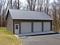 two garages in the middle of a parking lot